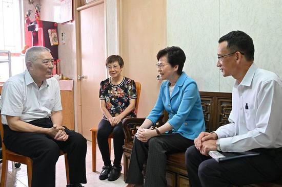 Chief Executive of the Hong Kong Special Administrative Region (HKSAR) Carrie Lam (R2) visits a couple of senior citizens at their home in Yau Ma Tei in Hong Kong on Sept. 13, 2019. (Credit: news.gov.hk)