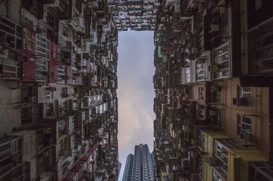 Photo taken on Sept. 18, 2019 shows residential buildings in Quarry Bay, south China's Hong Kong Special Administrative Region. (Xinhua/Lu Ye)