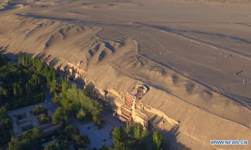 Aerial photo taken on Sept. 7, 2016 shows a view of the Mogao Grottoes in Dunhuang, northwest China's Gansu Province. （Photo/Xinhua）