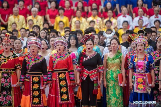 People take part in chorus performance to celebrate upcoming National Day