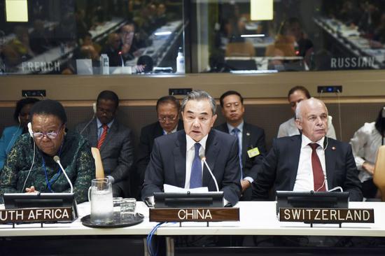 Chinese State Councilor and Foreign Minister Wang Yi (C) attends the commemoration of the 70th anniversary of the signing of the Geneva Conventions at the UN headquarters in New York, Sept. 23, 2019. (Xinhua/Han Fang)