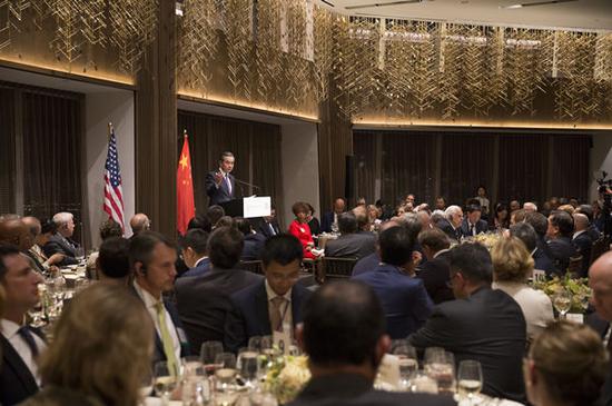 Chinese State Councilor and Foreign Minister Wang Yi delivers a keynote speech at a dinner co-hosted by the National Committee on U.S.-China Relations, the U.S.-China Business Council, the U.S. Chamber of Commerce, and Council on Foreign Relations in New York, the United States, Sept. 24, 2019. (China News Service/Liao Pan)