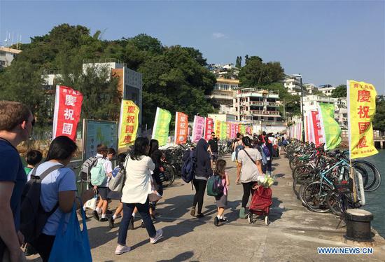 Flags to celebrate upcoming National Day seen at Lamma Island in Hong Kong