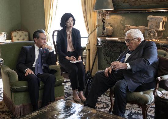Chinese State Councilor and Foreign Minister Wang Yi (L) meets with former U.S. Secretary of State Henry Kissinger (R) in New York, the United States, on Sept. 27, 2019. (Xinhua/Liu Jie)
