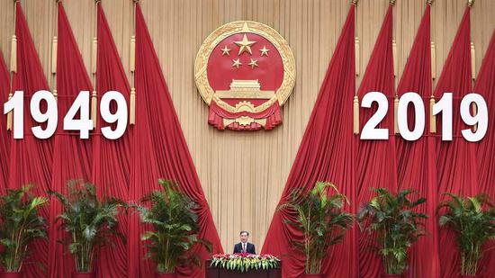 Wang Yang speaks at a reception celebrating the 70th anniversary of the founding the People's Republic of China (PRC) at the Great Hall of the People in Beijing, September 28, 2019. /Xinhua Photo