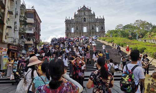 Macao's landmark Ruins of St. Paul welcomes tourists on Friday while the Hong Kong international airport experienced an anti-government protest that seriously disrupted operations. (Photo: Yang Sheng/GT)