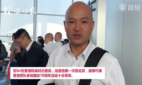 Hong Kong police sergeant Lau Chak-kei, who is invited to participate in the celebrations of the 70th anniversary for the founding of the People's Republic of China, has an interview with the Global Times on Sunday at the Hong Kong International Airport before leaving for Beijing. (Photo/Screenshot from video by Global Times)