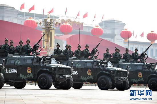 An anti-terrorist armed police force formation consisting of the country's newest anti-terrorist assault vehicles and armored anti-riot vehicles passed through the Tian'anmen Square on Oct. 1, 2019. (Photo/Xinhua)