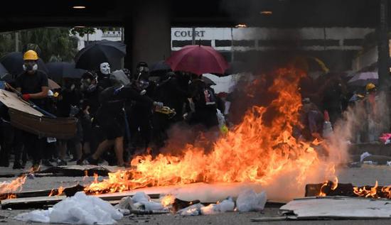 Rioters set fire outside government headquarters complex in Admiralty in south China's Hong Kong, Oct. 1, 2019. (Xinhua) 