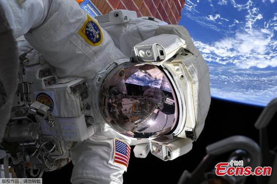 NASA astronauts spacewalk outside the International Space Station