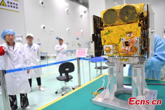 Technicians package the science experimental satellite BNU-1 at the Aerospace Dongfanghong Development in Shenzhen City, Guangdong Province, Aug. 14, 2019, before its transportation to the launch site. (Photo: China News Service/Chen Wen)