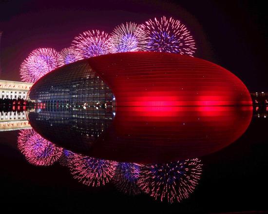 Fireworks light up the night sky above the National Center for the Performing Arts in Beijing, as the capital city holds a grand celebration to mark the 70th anniversary of the founding of the People's Republic of China on Oct 1, 2019. (Xinhua/Cai Yang)