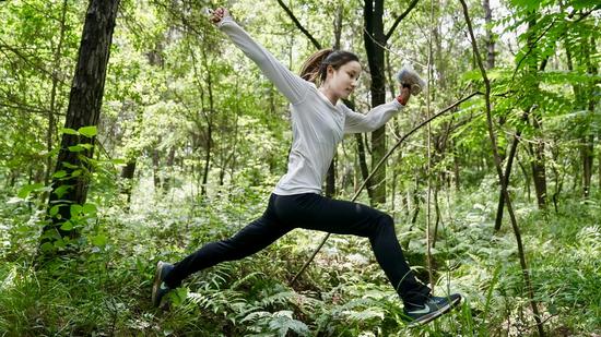 Li Meizhen trains in the forest. /Xinhua Photo