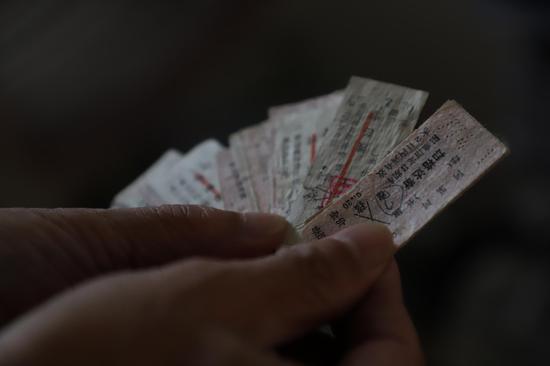 Zhao Yujun displays the old train tickets he has collected, Sept. 24, 2019. (Xinhua/Sun Xiaoyu)