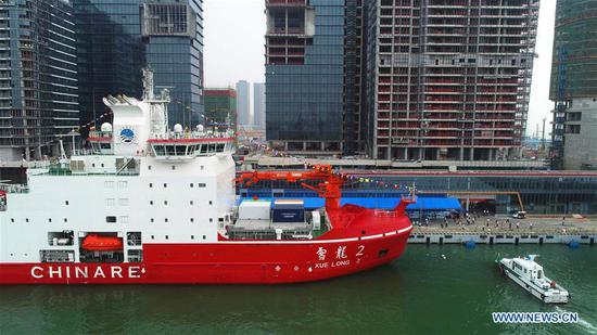 Aerial photo taken on Oct. 14, 2019 shows icebreaker Xuelong 2 moored in Shenzhen, south China's Guangdong Province. China's first domestically made polar icebreaker Xuelong 2, or Snow Dragon 2, will start its maiden voyage to the Antarctic from the southern Chinese city of Shenzhen Tuesday. Xuelong 2 will set sail on the country's 36th Antarctic expedition. Another icebreaker named Xuelong will also join the expedition, making it the first time that two polar icebreakers work together on China's Antarctic expedition. (Xinhua/Liu Shiping)