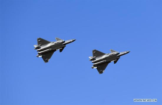 J-20 stealth fighters make a flight demonstration during an activity celebrating the 70th founding anniversary of the Chinese People's Liberation Army (PLA) air force in Changchun, capital of northeast China's Jilin Province, Oct. 17, 2019. It's the first time that J-20 stealth fighters and Y-20 transport aircrafts make a flight demonstration at the northeastern China during the activity. (Xinhua/Lin Hong)