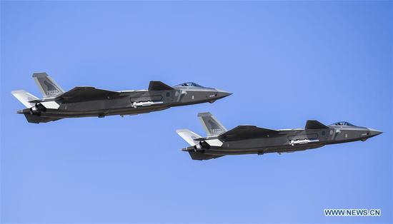 J-20 stealth fighters make a flight demonstration during an activity celebrating the 70th founding anniversary of the Chinese People's Liberation Army (PLA) air force in Changchun, capital of northeast China's Jilin Province, Oct. 17, 2019. (Xinhua/Lin Hong)