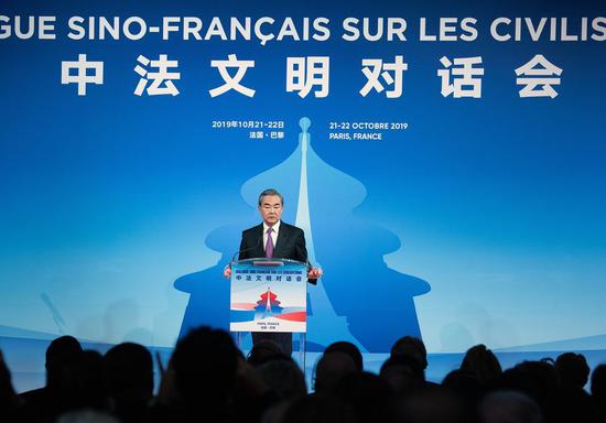 Chinese State Councilor and Foreign Minister Wang Yi gives a speech while attending the opening ceremony of the Sino-French Dialogue of Civilization in Paris, France, Oct. 21, 2019. (Photo by Jack Chan/Xinhua)