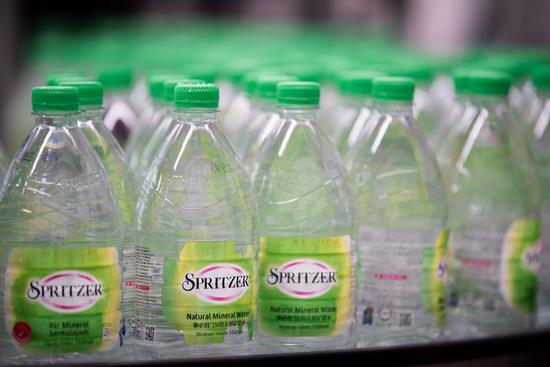 The production line is seen at Spritzer Natural Mineral Water Plant in Taiping, Perak, Malaysia, Oct. 21, 2019. (Xinhua/Zhu Wei)