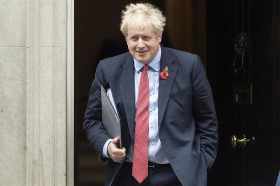 British Prime Minister Boris Johnson leaves 10 Downing Street in London, Britain, on Oct. 29, 2019. Britain looks set to hold the general election on Dec. 12 after lawmakers on Tuesday night voted to back it following months of Brexit deadlock. (Photo by Ray Tang/Xinhua)