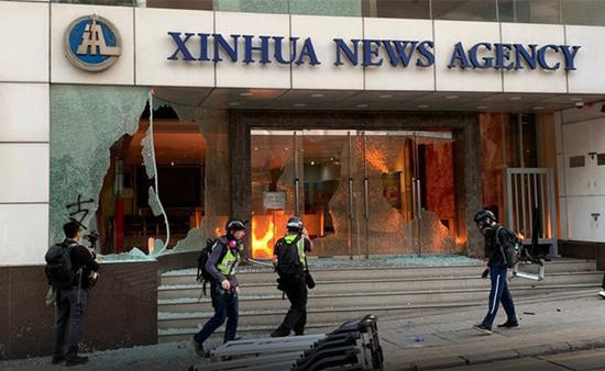 condemns,violates xinhua strongly condemns vandalizing of its hong kong office by