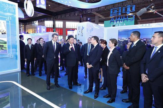 Chinese President Xi Jinping, together with foreign leaders who are attending the second China International Import Expo (CIIE), tour the exhibitions after an opening ceremony of the CIIE in Shanghai, east China, Nov. 5, 2019. (Xinhua/Ju Peng)