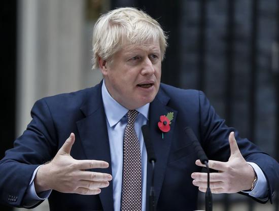 British Prime Minister Boris Johnson makes a statement outside 10 Downing Street in London, Britain on Nov. 6, 2019.(Xinhua/Han Yan)