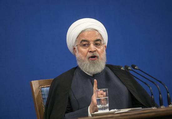 Iranian President Hassan Rouhani speaks at a press conference in Tehran, Iran, on Oct. 14, 2019. (Photo by Ahmad Halabisaz/Xinhua)