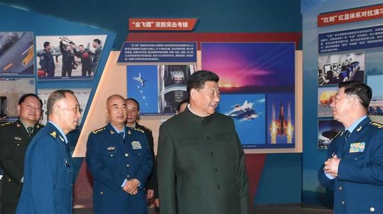 Chinese President Xi Jinping, also general secretary of the Communist Party of China (CPC) Central Committee and chairman of the Central Military Commission (CMC), visits an exhibition marking the 70th founding anniversary of the People's Liberation Army (PLA) Air Force at the China Aviation Museum in Changping District, Beijing, capital of China, Nov. 8, 2019.  （Photo/Xinhua）