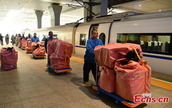 Bags of parcels containing goods purchased during the Singles’ Day shopping festival are loaded onto a train at a station in Chengdu City, Sichuan Province for delivery to Nanjing City in Jiangsu Province, Nov. 11, 2019. China’s rapid railway network is also contributing to the fast transportation of numerous express parcels, which can reach a historical high during the Nov. 11 Singles' Day sales, one of the largest online shopping sprees worldwide. (Photo: China News Service/Liu Zhongjubn)