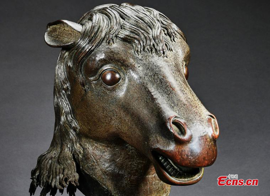 A red bronze horse-head statue is handed over to the National Cultural Heritage Administration in Beijing on Nov. 13, 2019. (Photo provided to China News Service)