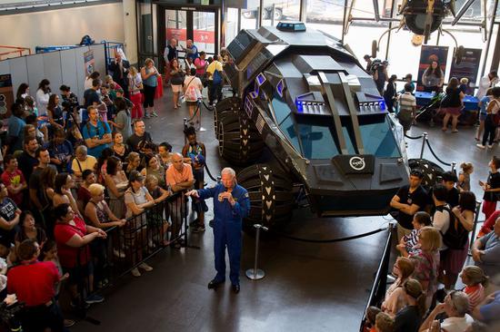 Retired NASA Astronaut Jon McBride speaks to the crowd in front of the NASA Mars rover concept vehicle during Mars Day at the National Air and Space Museum in Washington D.C., the United States, on July 21, 2017. (Xinhua/Ting Shen)