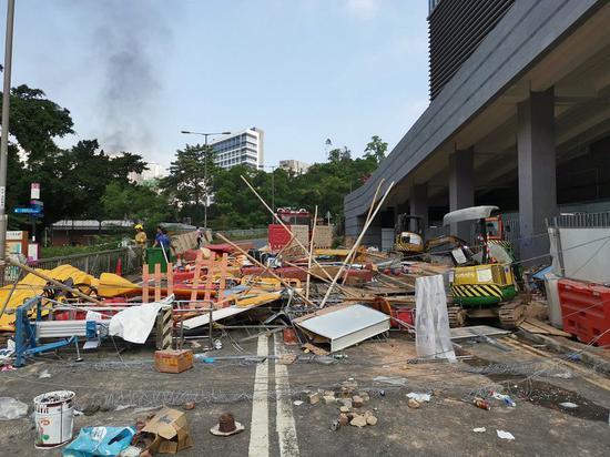 This photo shows a road near the Chinese University of Hong Kong blocked by rioters. (Xinhua)