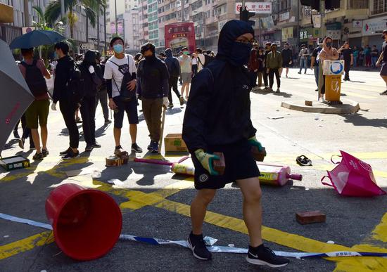 Rioters conduct disruptive activities in Sai Wan Ho, south China's Hong Kong, Nov. 11, 2019. (Xinhua)
