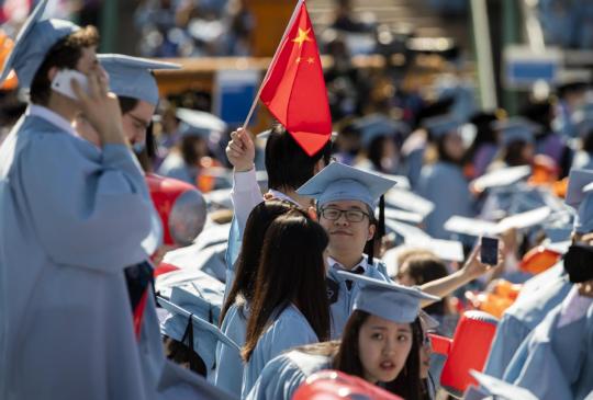 Chinese students attend a graduation ceremony at Columbia University in New York in May. (WANG YING/XINHUA)