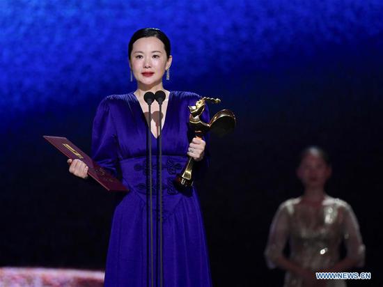 Yong Mei is honored with the Best Actress Award for the movie 