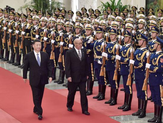 Chinese President Xi Jinping holds a welcome ceremony for Suriname's President Desire Bouterse before their talks at the Great Hall of the People in Beijing, capital of China, Nov. 27, 2019. (Xinhua/Yue Yuewei)