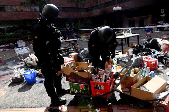 Hong Kong police, firefighters enter Hong Kong Polytechnic University for investigation on Nov. 28, 2019 in Hong Kong, China. (Xinhua)