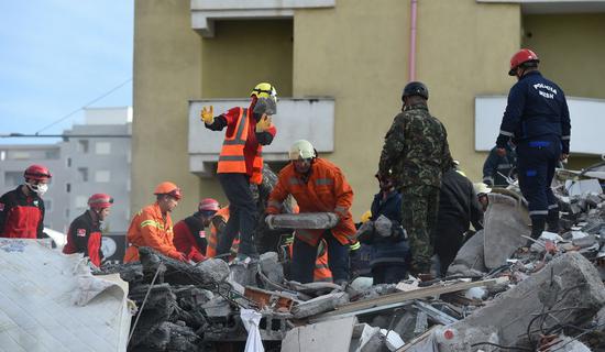 Rescuers work at the site of a collapsed building in the town of Durres, Albania. (Xinhua/Zhang Liyun)