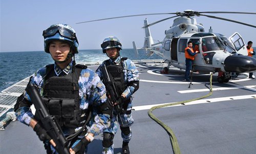 Soldiers are seen on a naval vessel during a joint naval exercise on the sea off Qingdao, east China's Shandong Province, on April 26, 2019. China conducted a joint naval exercise with Southeast Asian countries in Qingdao, with focus on jointly handling pirate threats and maritime emergency rescues.(Photo: Xinhua)