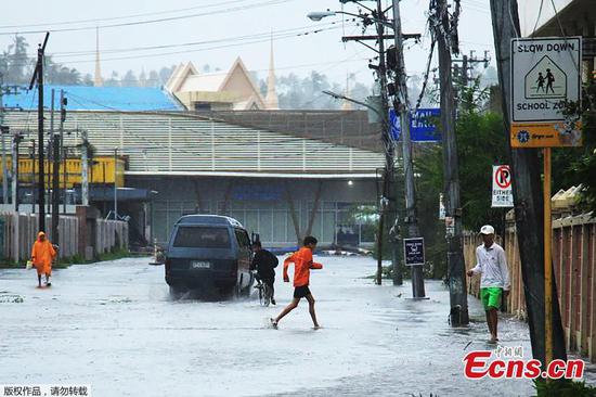 Thousands evacuated as typhoon strengthens and makes landfall in Philippines