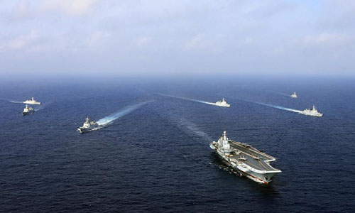 The aircraft carrier Liaoning battle group steam on the sea. The aircraft carrier Liaoning (Hull 16), several guided-missile destroyers, frigates and dozens of aircraft attached to the Navy of the Chinese People's Liberation Army took part in a combat exercise at an unidentified area east of the Bashi Channel in the western Pacific on Apr. 20. The exercise was a routine arrangement as a part of the PLA Navy's annual training plan. (Photo/eng.chinamil.com.cn)