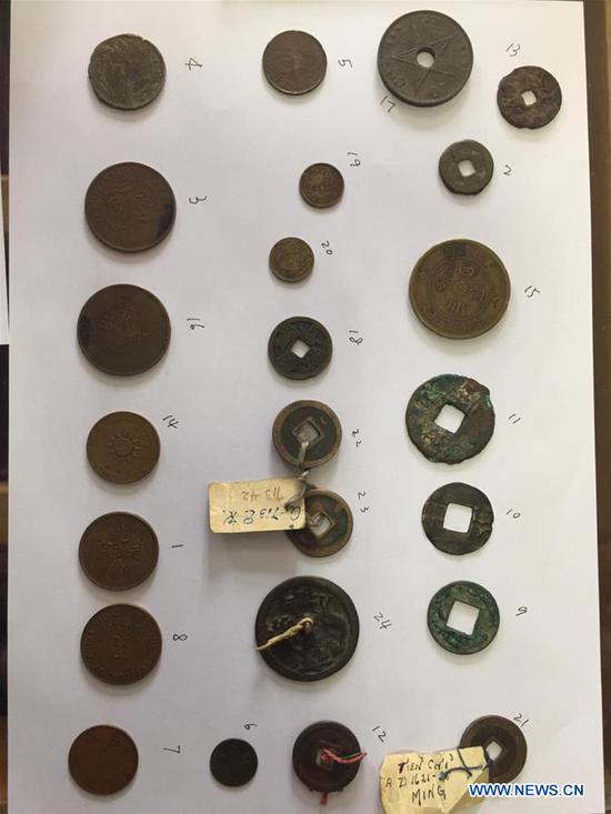 Photo taken on Dec. 9, 2019 shows dozens of smuggled ancient Chinese coins in Alexandria, Egypt. A delegation of Chinese officials from Chinese embassy in Egypt and officials from Egyptian Ministry of Antiquities inspected and sealed dozens of smuggled ancient Chinese coins in Egypt's coastal city of Alexandria, a Chinese official said on Monday. (Egyptian Ministry of Antiquities/Handout via Xinhua)