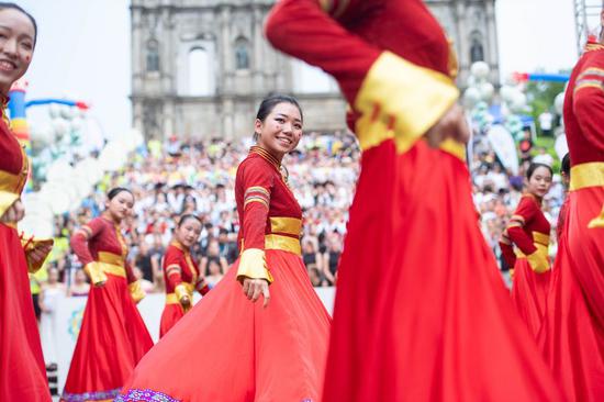 Dancers perform in front of the Ruins of St. Paul's during a parade of the International Youth Dance Festival in south China's Macao, July 20, 2019. (Xinhua/Cheong Kam Ka)