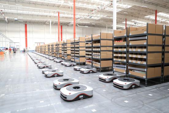 Photo taken on April 12, 2019 shows delivery robots in the China's online retailer giant JD.com's 