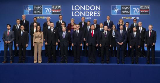 NATO leaders pose for a group photo at the NATO Summit in London, Britain, on Dec. 4, 2019. (Xinhua/Han Yan)