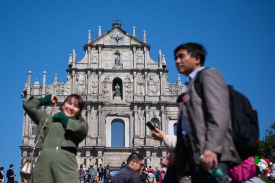 People visit the Ruins of St. Paul's complex in Macao, south China, Dec. 12, 2019. (Xinhua/Cheong Kam Ka)