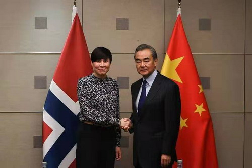 Chinese State Councilor and Foreign Minister Wang Yi (R) meets with Norwegian Foreign Minister Ine Eriksen Soreide on the sidelines of the 14th Foreign Ministers' Meeting of the Asia-Europe Meeting (ASEM) in Madrid, Spain, December 15, 2019. /Photo via .fmprc.gov.cn