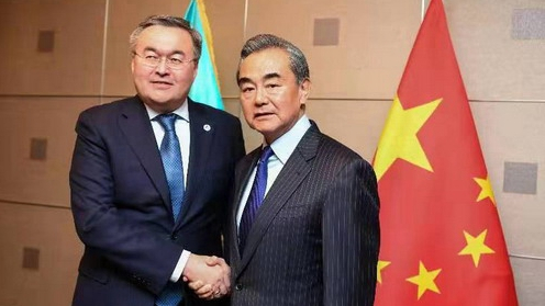 Chinese State Councilor and Foreign Minister Wang Yi (R) meets with his Kazakh counterpart Mukhtar Tleuberdi on the sidelines of the 14th Foreign Ministers' Meeting of the Asia-Europe Meeting (ASEM) in Madrid, Spain, December 15, 2019. /Photo via .fmprc.gov.cn