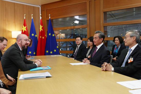 Chinese State Councilor and Foreign Minister Wang Yi (2nd R, front) meets with president of the European Council Charles Michel at the EU headquarters in Brussels, Belgium, Dec. 17, 2019. (Xinhua/Zheng Huansong)